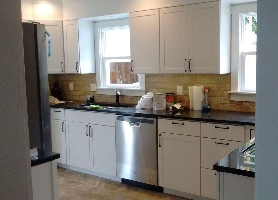 Kitchen with white cabinets and stainless appliances